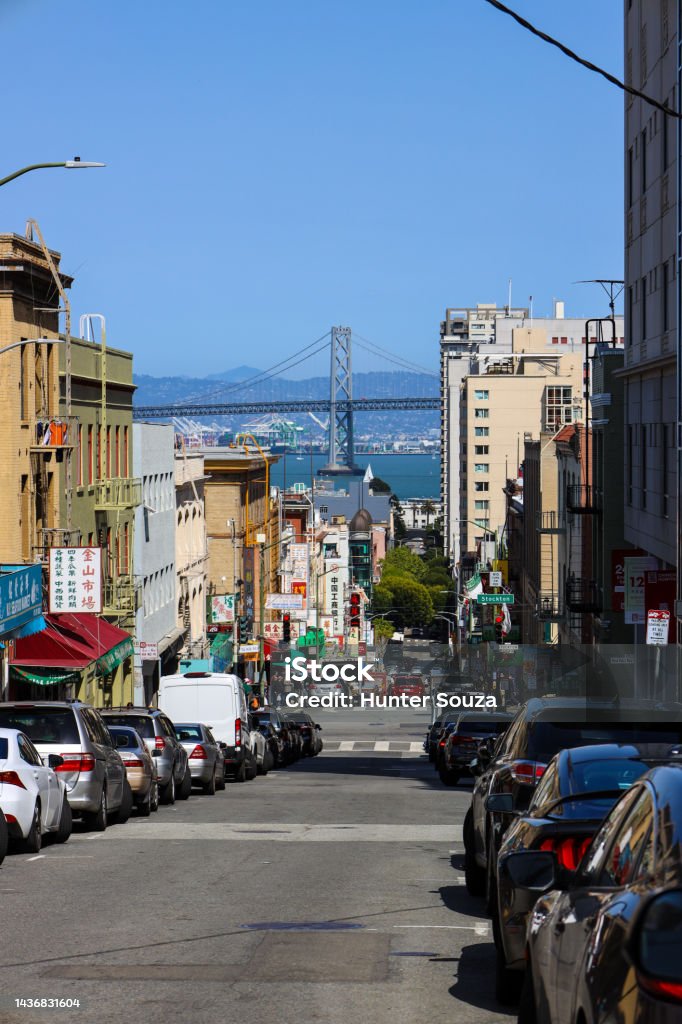 Looking down the city streets of San Francisco china town with the bay bridge off in the distance San Francisco china town views of the bay bridge Architecture Stock Photo