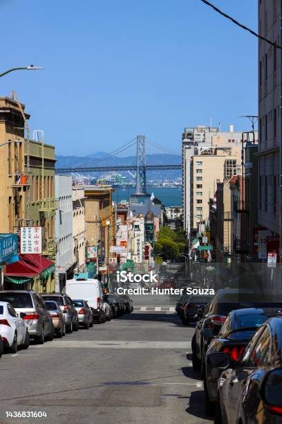 Looking Down The City Streets Of San Francisco China Town With The Bay Bridge Off In The Distance Stock Photo - Download Image Now