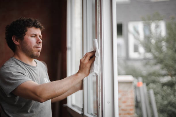 istock Caucasian man cleans the window frame. 1436833137