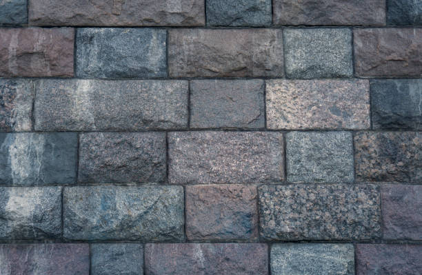istock Stone wall background. Texture of a stone wall close-up. copy space. 1436835870