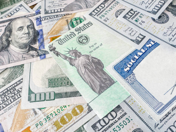 istock Stimulus check, 100 dollar bills and social Security Card 1436837181