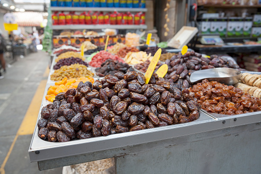 Jerusalem, Israel - 06/21/2022:   Dried dates and other dried fruits on display at Mahane Yehuda Market in Jerusalem.