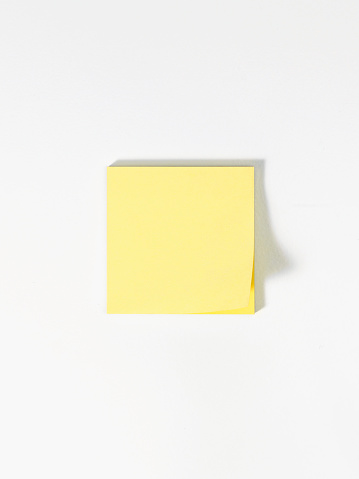 Looking down on a stack of blank adhesive notes