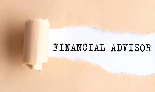 The text FINANCIAL ADVISOR appears on torn paper on white background.