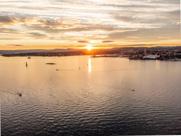 Aerial view of sunset over the Fjord of Oslo, Norway. Summer evening with some clouds, view of Oslo City.