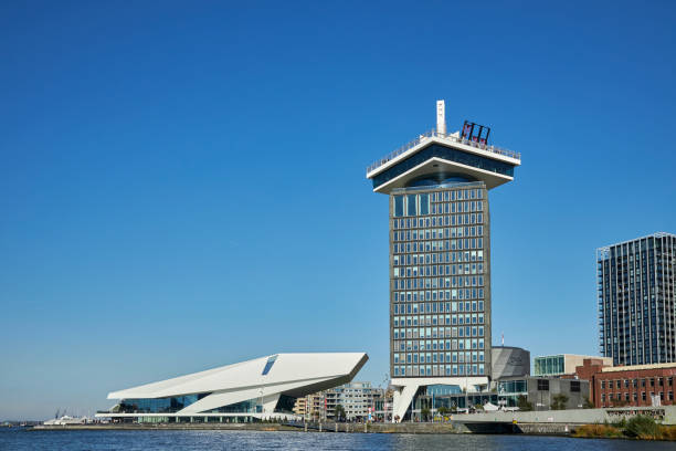 A'DAM Tower and EYE Film Museum waterfront skyline, Amsterdam-Noord A'DAM Tower and EYE Film Museum waterfront skyline on a summer day, Amsterdam-Noord, The Netherlands. lookout tower stock pictures, royalty-free photos & images
