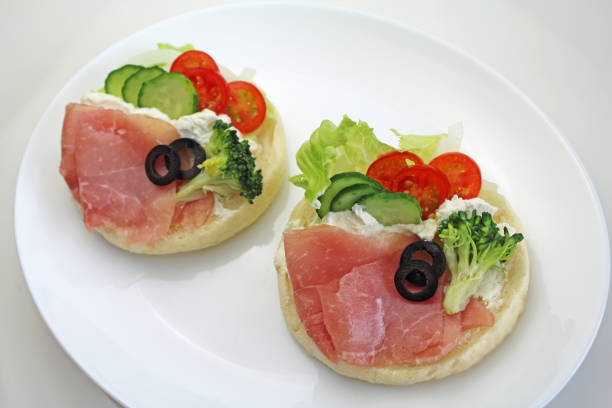 istock Open sandwich with prosciutto, fresh vegetables and cream cheese 1436865625