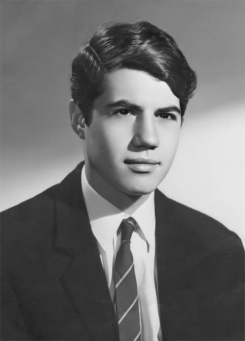 Black and white Image taken in the 60s: Studio headshot of a young man