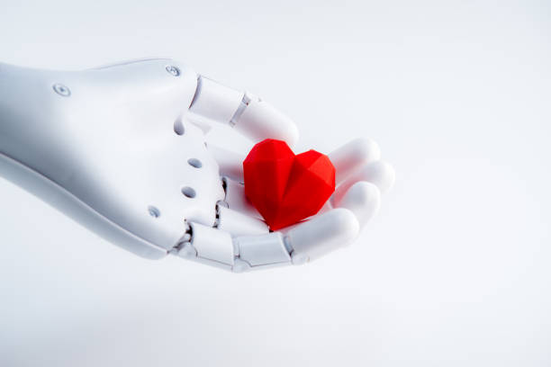 istock Robot hand holding red heart,white background 1436877178