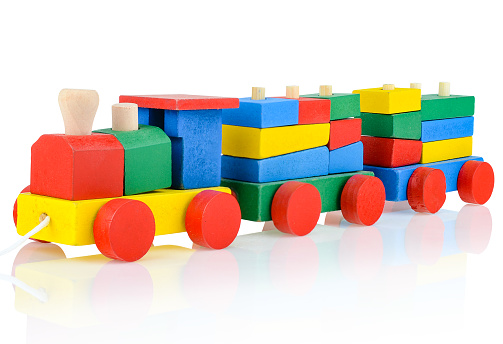 Wooden children's constructor-a steam train, isolated on a white background. Colorful toy train. Educational games for children. Design and modeling.