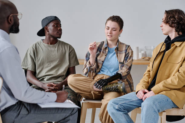 istock Girl discussing her mental condition at psychology class 1436883900