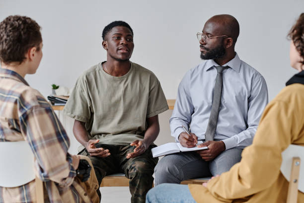 istock Teenage boy sharing his problems with people 1436884018