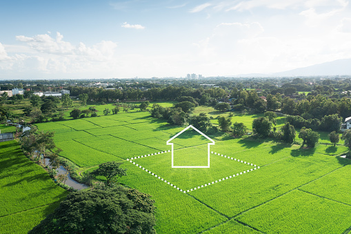 Land or landscape of green field in aerial view or bird eye view. Include agriculture farm, icon of residential, home or house building and land plot. Real estate or property for dream concept to build, construction, owned, sale, rent, buy, purchase, mortgage and investment in Chiang Mai of Thailand.