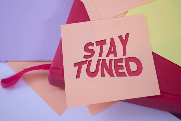 istock Stay Tuned. Text on adhesive note paper. Event, celebration reminder message. 1436887463