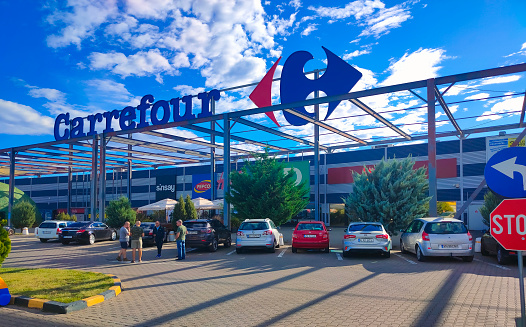 Focsani, Romania - September 12, 2022: Entrance of the Carrefour hypermarket. Carrefour is one of the most important hypermarket chains in Europe