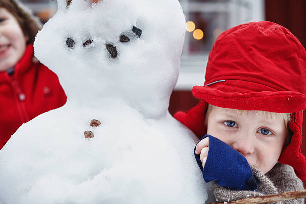 крупный план мальчик фигуру снеговик - sibling sweden family smiling стоковые фото и изображения