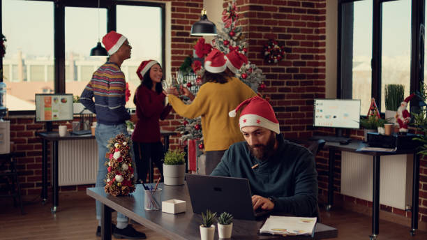istock Stressed man being interrupted by joyful colleagues 1436900702