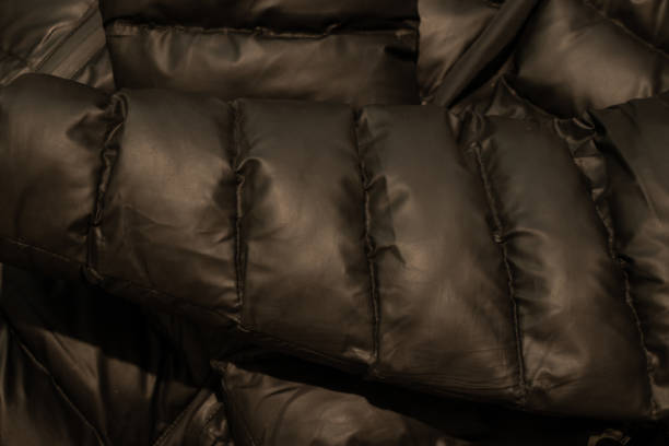 istock black down jacket winter puffed as a background close up 1436900943
