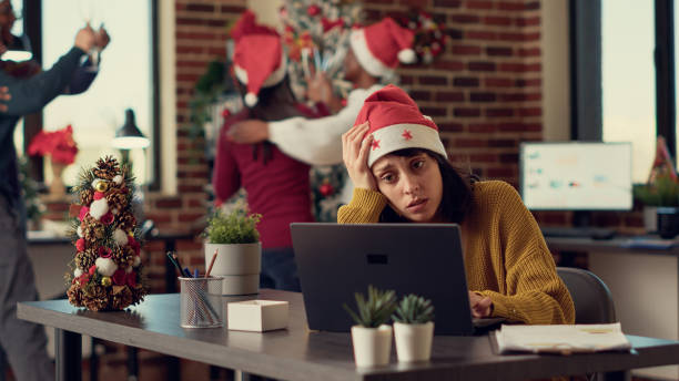 istock Festive people disturbing stressed woman during christmas time 1436902347