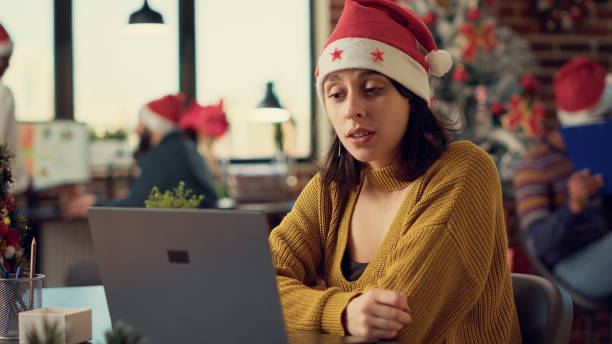 istock Festive woman talking on online videocall conference 1436902606