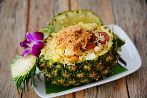 Thai rice with chicken in pineapple plate