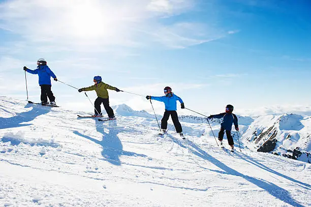 Photo of Children climbing snowy mountainside