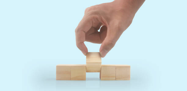 istock Wooden cubes in hand with copy space for input wording 1436903129