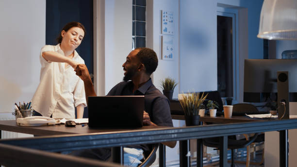 istock Company employee working late at night in startup office 1436905461