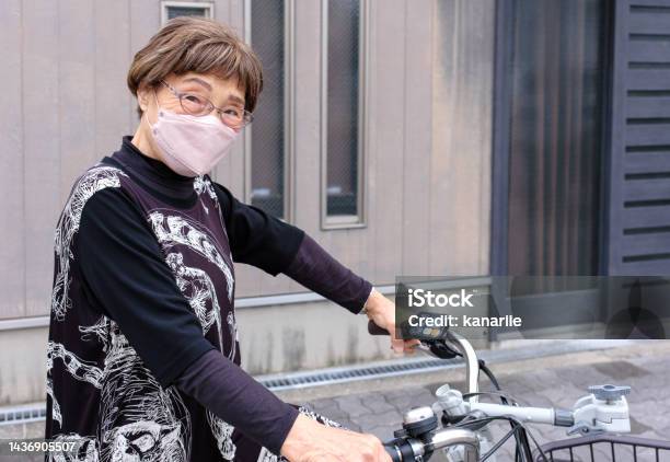 Senior Woman With Bicycle Stock Photo - Download Image Now - Bicycle, Cycling, Electric Bicycle