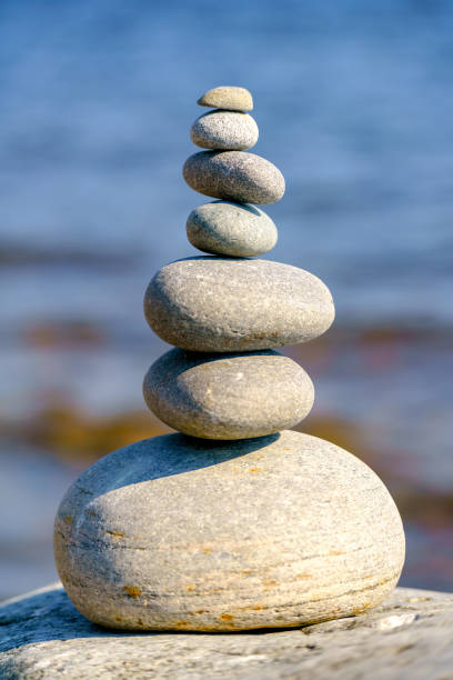istock Pyramid of stones. Unstable balance of stone objects. 1436905564
