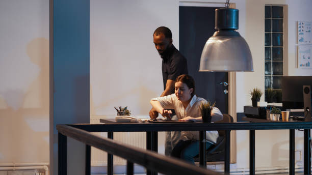 istock Female freelancer leaving startup office late at night 1436907538