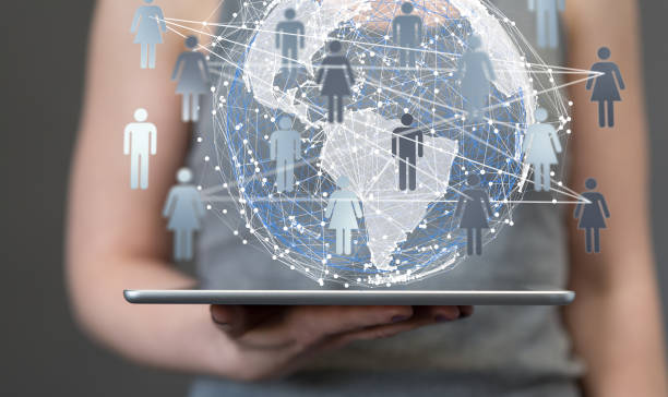 istock 3D rendered futuristic globe with users connected to each other held in a person's hand 1436911201