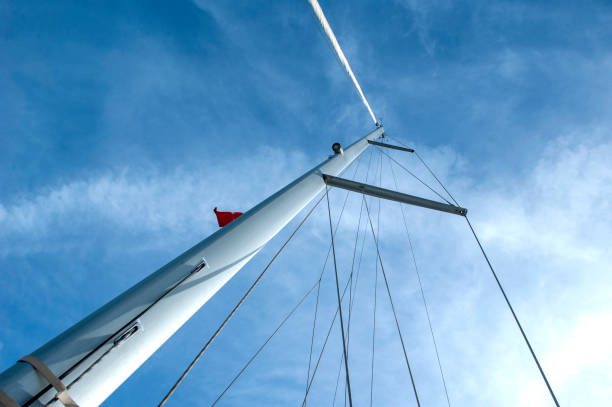 Yacht Mast Against Blue Sky stock photo