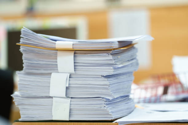istock extreamly close up the stacking of office working document with paper clip folder at office 1436911726