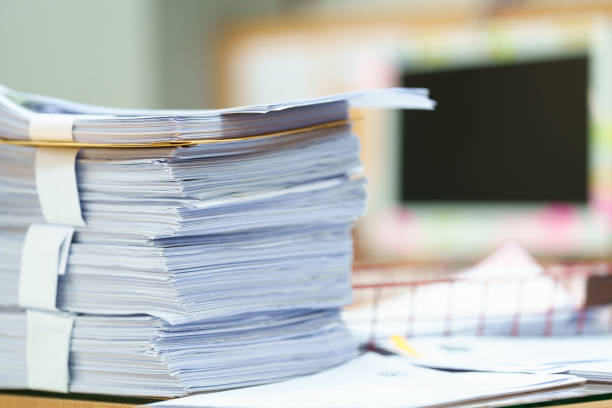 istock extreamly close up the stacking of office working document with paper clip folder at office 1436911729