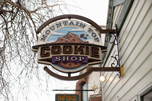 breckenridge, United States – January 17, 2018: A low-angle shot of the mountain top cookie shop sign on Main Street