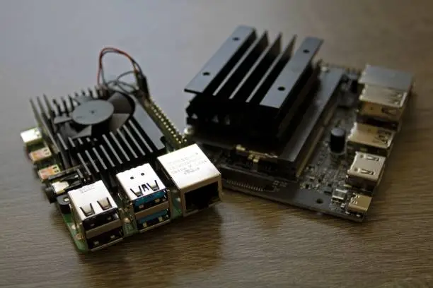 Closeup of electrical engineering programming microcomputers - raspberry Pi 4B w Heatsink Nvidia Jetson nano