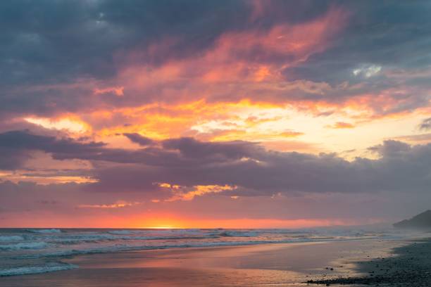 istock Sandy, tropical beach at sunset with mesmerizing sky 1436912659