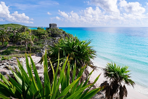 A distant view of the historical Tulum Archaeological Zone ruins in Mexico