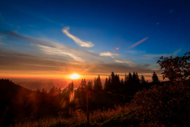 istock Beautiful sunset over the snowy hills 1436914767