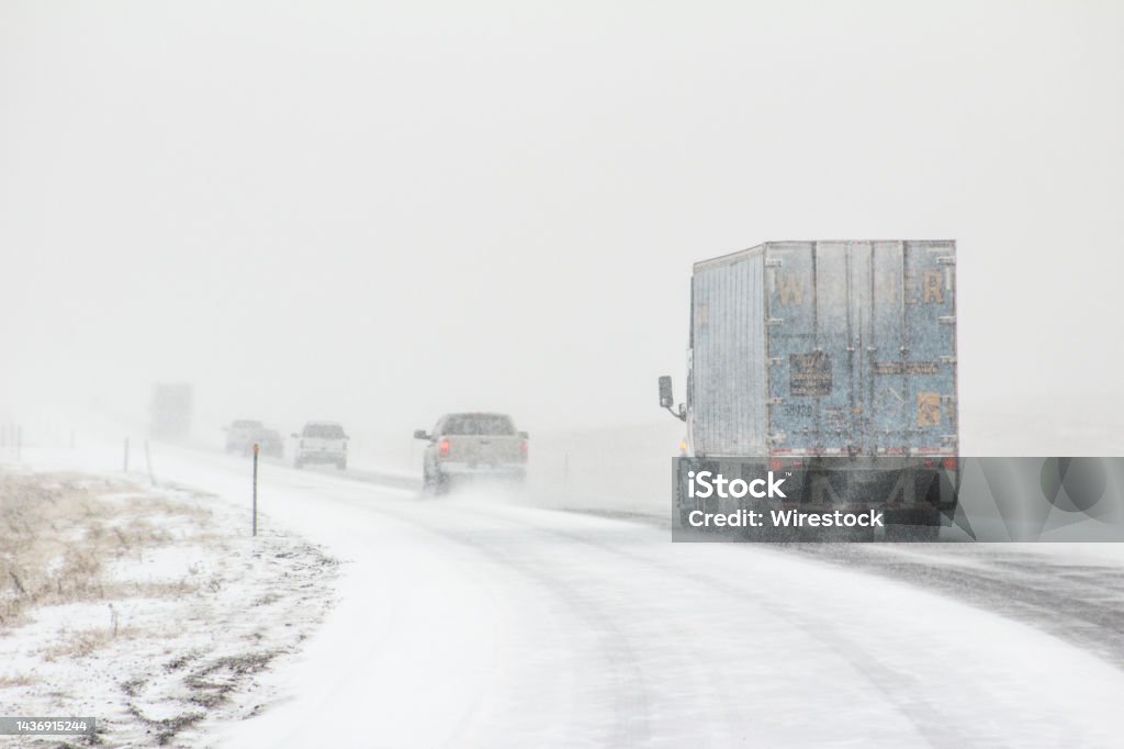 Winter road conditions with vehicles on I-80 in Southern Wyoming near Vedauwoo and Buford, WY The winter road conditions with vehicles on I-80 in Southern Wyoming near Vedauwoo and Buford, WY Cold Temperature Stock Photo