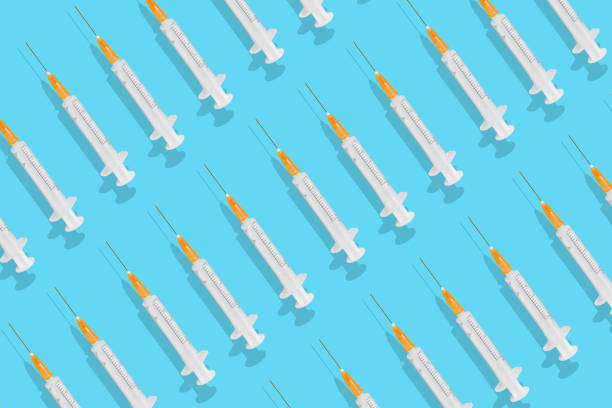 istock Syringes isolated on blue background 1436915453