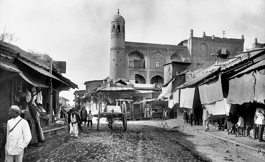 Tashkent, Uzbekistan – December 06, 2012: A grayscale shot of a market street in Tashkent, Uzbekistan, at the beginning of the 20th century