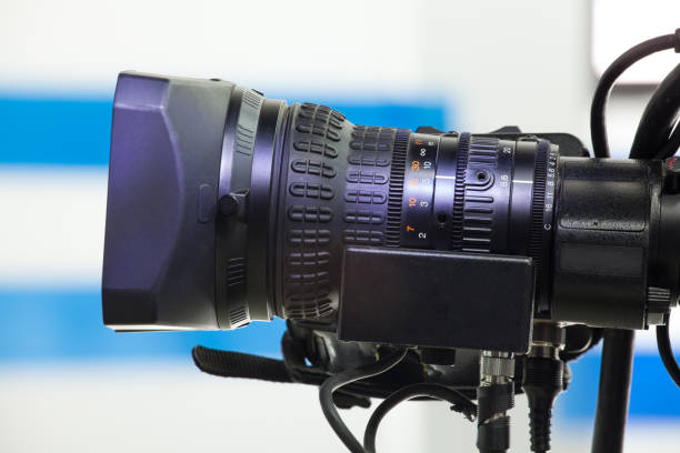 istock Video camera lens - recording a show in a TV studio 1436916271