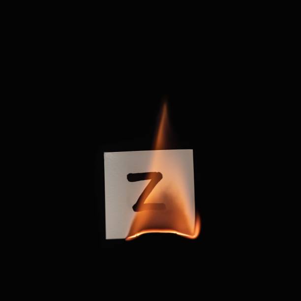 istock Small paper with letter Z burning on a black background 1436916631
