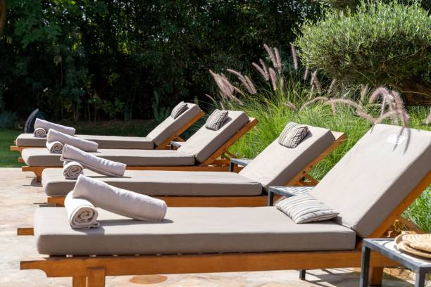 istock Lounge chairs by the pool on a sunny day 1436918467