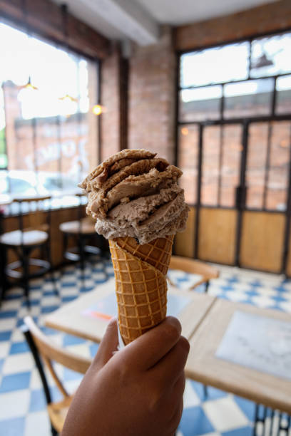 istock Hand held ice cream cone or gelato 1436919539