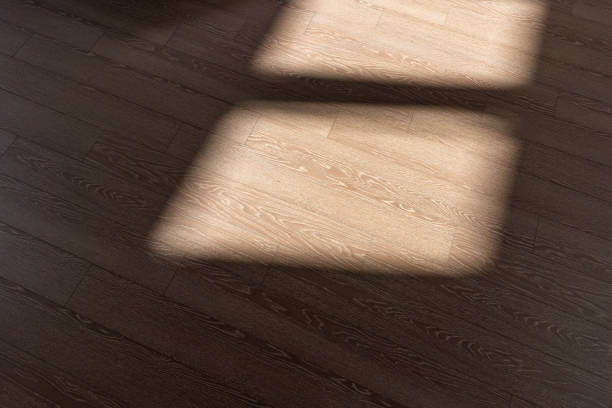 istock The light and shadow that the sun shines on the floor through the window 1436920221