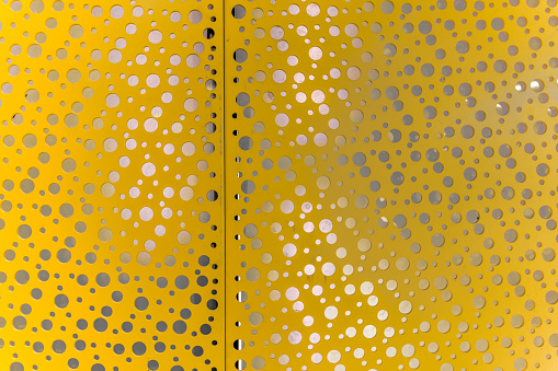 Golden ceiling with round holes