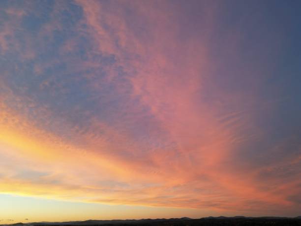 istock Pink-blue sunset sky over the forest 1436922651